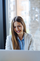 Beautiful Young Woman Working on Laptop