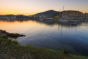Fototapeta na wymiar View of a marina in Lakki village on Leros island in Greece early in the morning. 