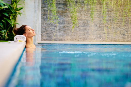 Beauty And Body Care. Sensual Young Woman Relaxing In Outdoor Spa Swimming Pool.