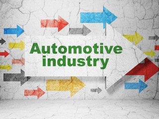 Manufacuring concept: arrow with Automotive Industry on grunge wall background