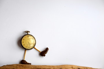 the time marches on, symbolic picture of an old pocket watch with legs and shoes marching