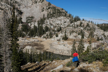 A child looks at the mountains and Lake Mary. Lake Mary Trail, Uinta-Wasatch-Cache national forest, Utah, United States