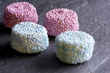 Gummy Candy Sprinkle Coated on Dark Stone Background