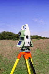 Total station. Survey Instrument geodetic device. Fall time land surveying, total station set in...