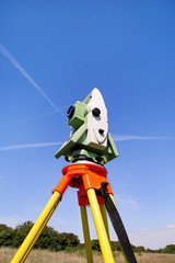 Total station with blue sky in the background. Survey Instrument geodetic device, total station set...