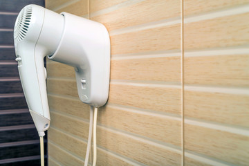 Fototapeta premium Beige hairdryer in bathroom