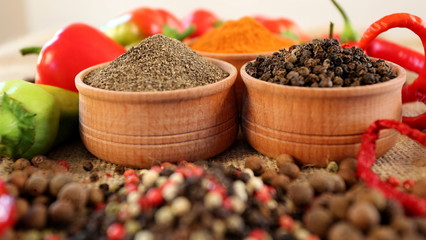 Macro mixing spices. Set peppers to meat dishes. Chilli and black allspice