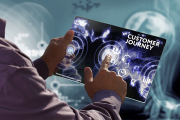 Business, Technology, Internet and network concept. Young businessman working on a virtual screen of the future and sees the inscription: Customer journey