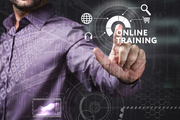 Business, Technology, Internet and network concept. Young businessman working on a virtual screen of the future and sees the inscription: Online training