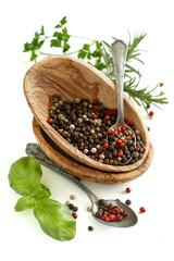 Peppercorn mix in a bowl, bay leaves  and olive oil