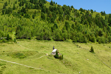Obraz premium Idyllic mountain scenery with little church in the Alps. Austria, Zillertal High Road, Tirol
