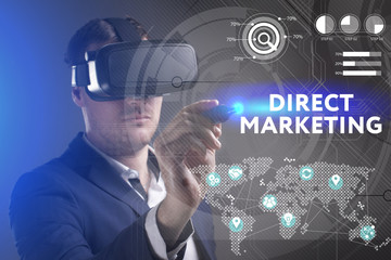 Business, Technology, Internet and network concept. Young businessman working in virtual reality glasses sees the inscription: Direct marketing