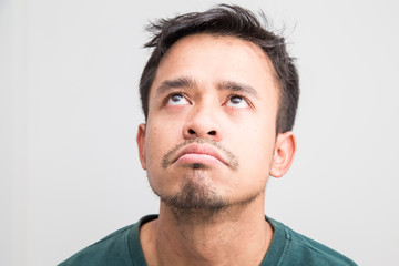 Fototapeta premium Crazy frown asian man on white background, Upset feeling