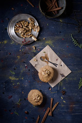 Freshly baked walnut and cinnamon cupcakes on the table.