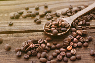 coffee beans in wooden spoon