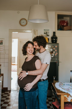 pregnant couple in kitchen