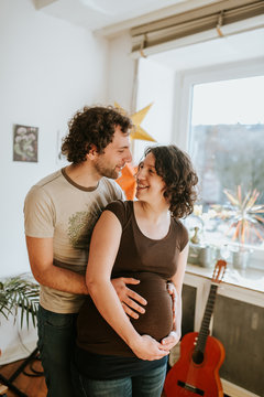 pregnant couple at home