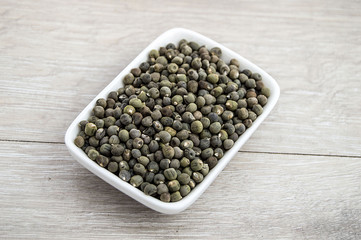 Ready to plant very clearly with white back ground okra seeds, okra seeds in the plate,
