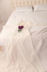 Obraz na płótnie Canvas Negligee for the bride on the bed