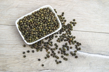 Ready to plant very clearly with white back ground okra seeds, okra seeds in the plate,
