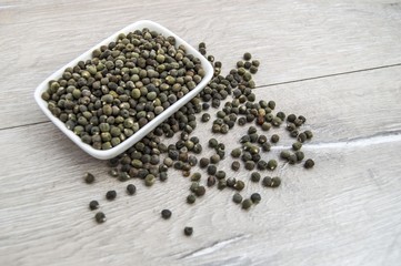 Ready to plant very clearly with white back ground okra seeds, okra seeds in the plate,
