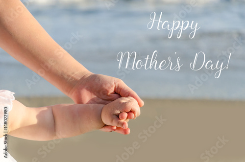 Happy Mother's day background with Mother's and child's holding hands