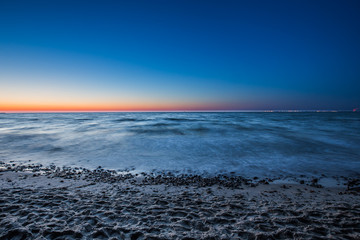 Amazing sunrise on the pier at the seaside. Gdynia Orlowo, Poland