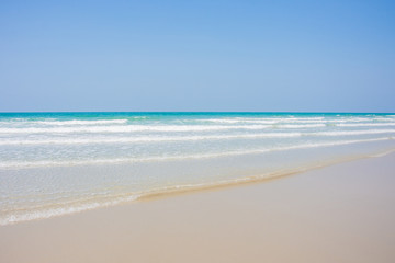 Fototapeta na wymiar wave sea and sand on beach asia