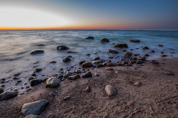 Amazing sunrise on the pier at the seaside. Gdynia Orlowo, Poland