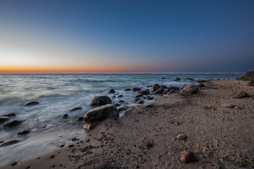 Amazing sunrise on the pier at the seaside. Gdynia Orlowo, Poland