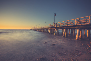 Fototapeta premium Amazing sunrise on the pier at the seaside. Gdynia Orlowo, Poland