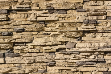 Flat rocks layered to form a solid wall