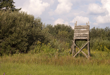 Hunting tower in the field for deer and boar game