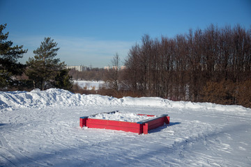 sandbox in snow