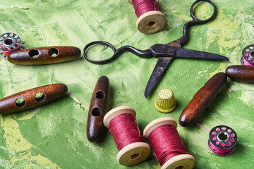 sewing supplies on green background