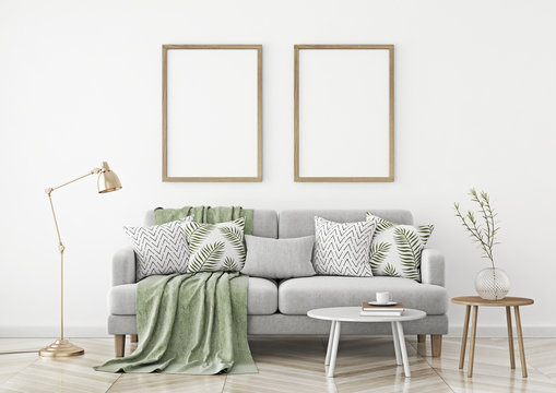 Interior poster mock up with two vertical frames hanging over a sofa in scandinavian style livingroom. 3d rendering.