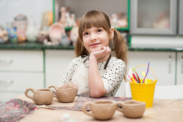 girls in the studio are made of ceramic cups 