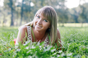 young woman lying on the grass