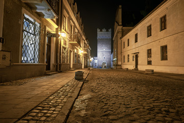 Old town of Sandomierz, Opatow gate in the background at night