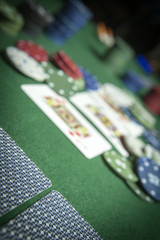 Obraz premium cards poker deck English, poker chips stack on green table
