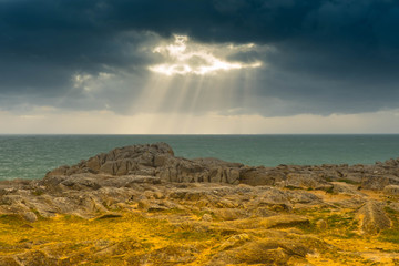 Severe weather on the Atlantic coast with sunshine through the clouds, Brittany, France