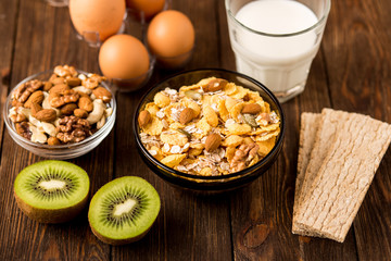 Oat flakes with milk and nuts. Fitness breakfast.  Healthy eating, dieting, slimming and weigh loss concept.