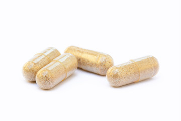 Natural medicine capsules isolated on a white background