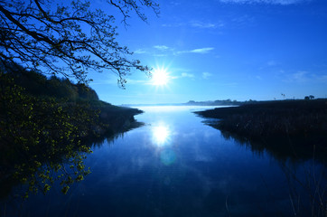 Beautiful blue sunrise over a quiet lake in northern France