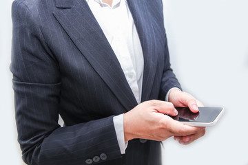 Attractive Modern business woman Hand Touching and Using Digital mobile smart phone with black screen in Suit .