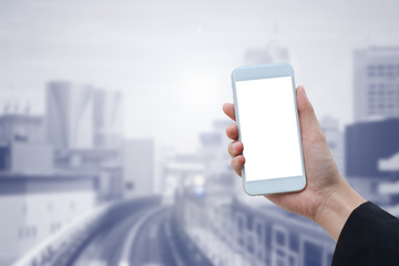 close up business woman hand holding blank empty smartphone screen on blur modern city building landscape background.