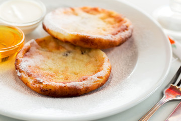 Ukrainian breakfast cheesecakes with honey