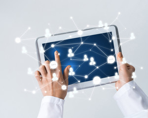 Close of female doctor hands working with tablet pc computer