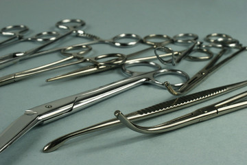 Medical surgical Instruments on blue background.