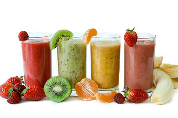 Four different smoothies of berry, banana with tangerine, kiwi, strawberries.